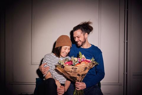 Couple with bright flowers