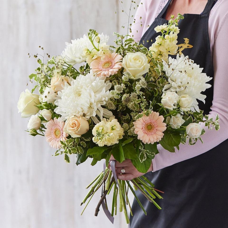 Sympathy hand-tied made with the finest flowers