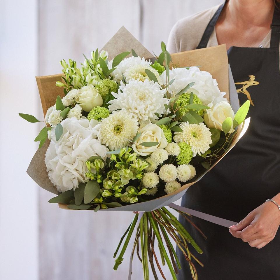 Sympathy hand-tied made with the finest flowers