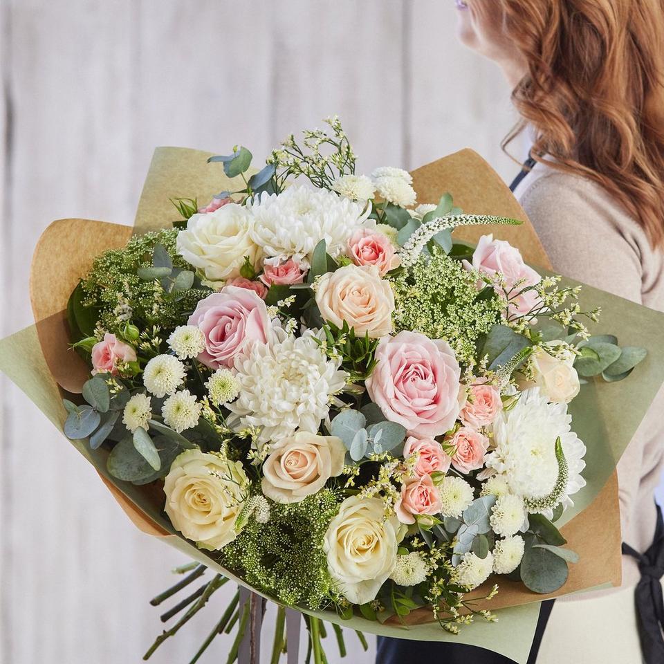 Sympathy hand-tied made with the finest flowers