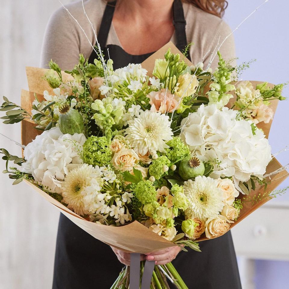 Sympathy hand-tied made with the finest flowers