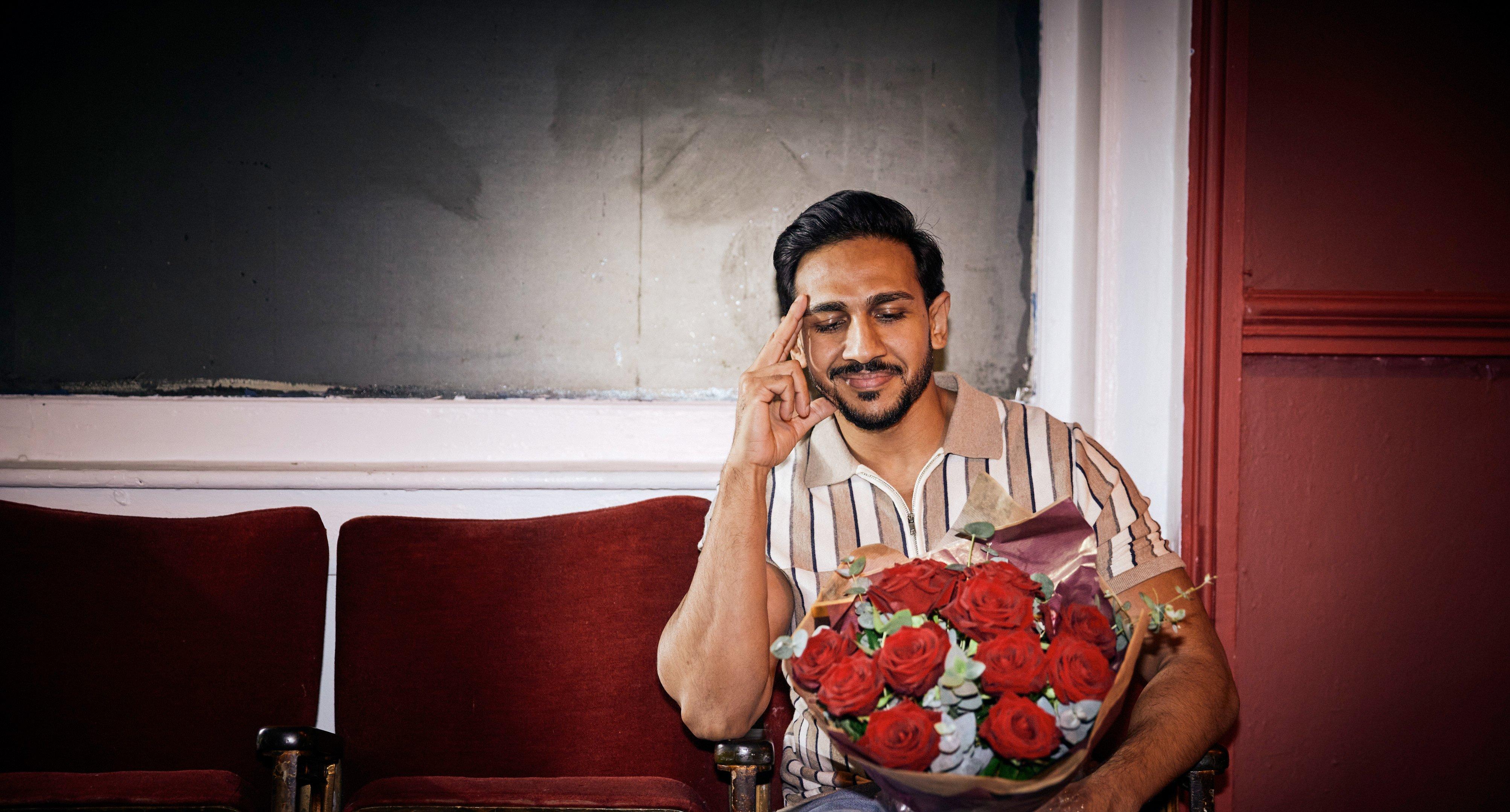 Man looking at flowers