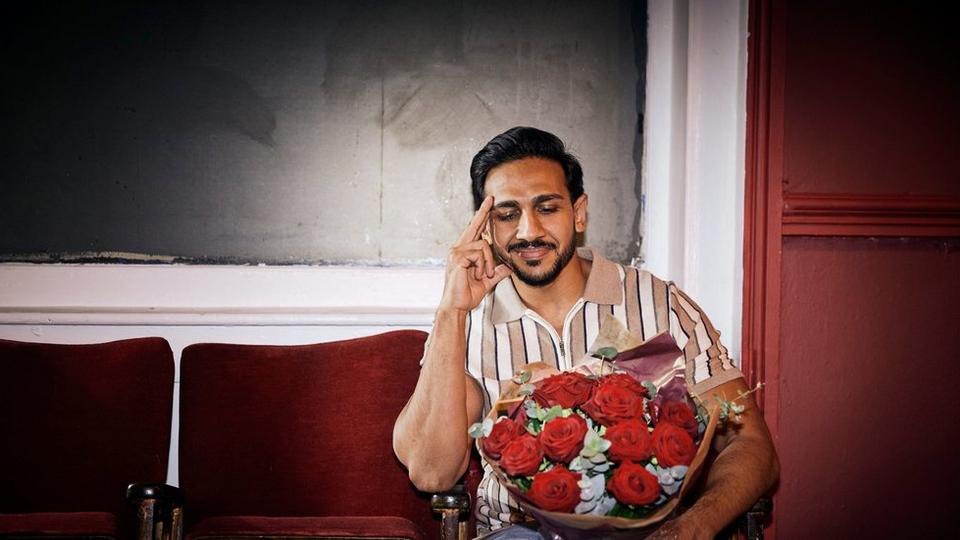 Man looking at flowers