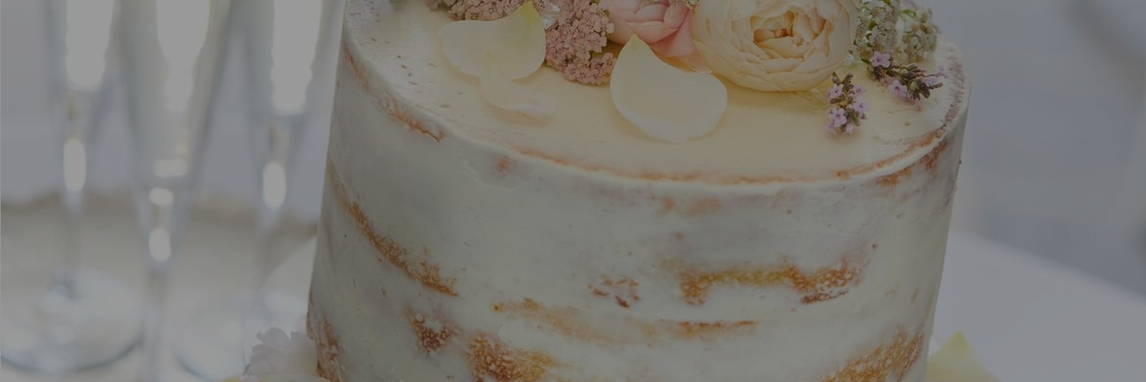 Naked-wedding-cake-decorated-with-pink-flowers