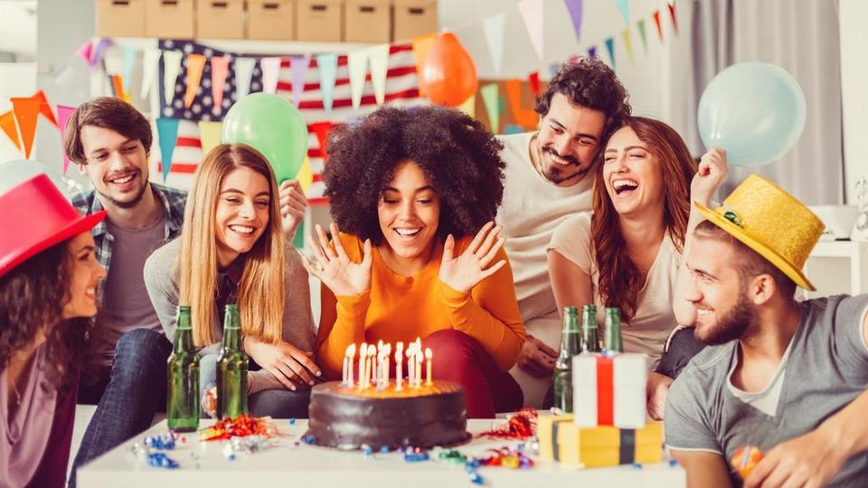birthday-celebrations-around-table-with-cake