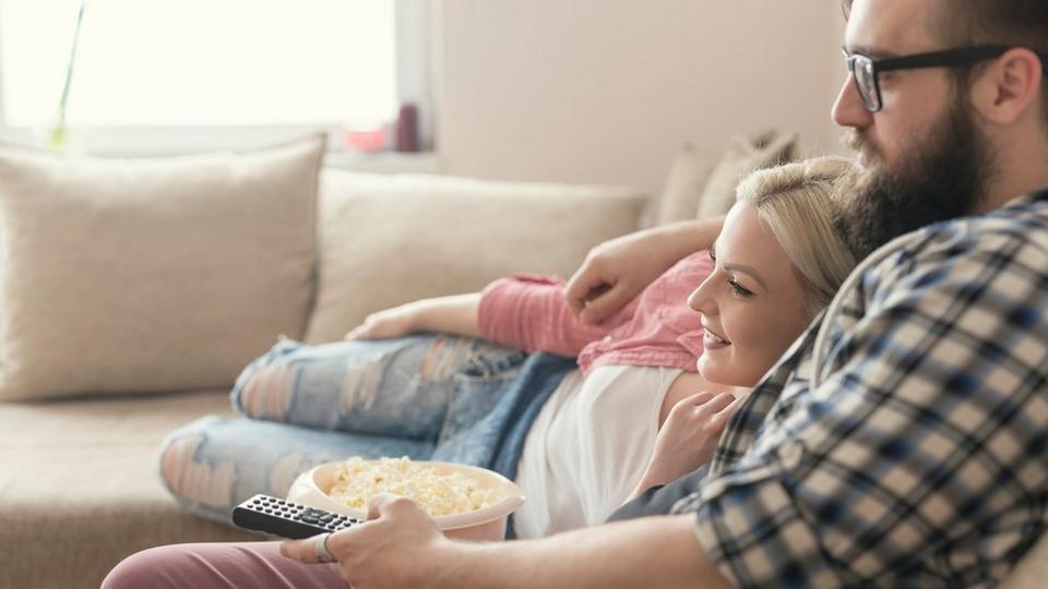 couple-cuddling-sofa