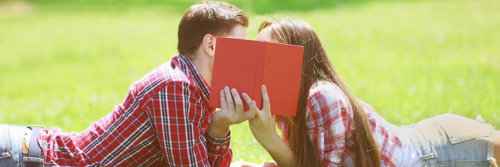 couple-reading-book-outdoors