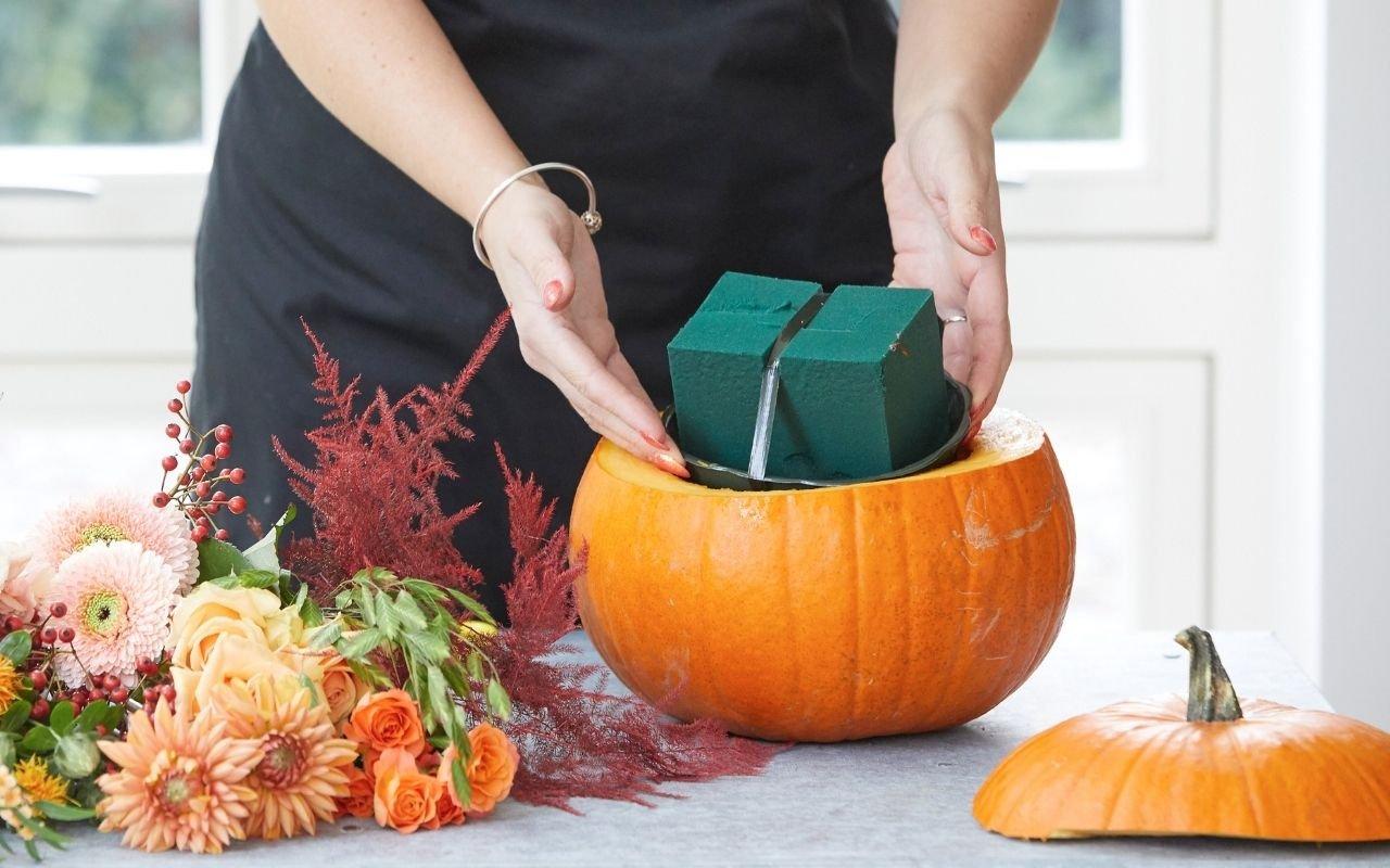florist-placing-oasis-in-pumpkin