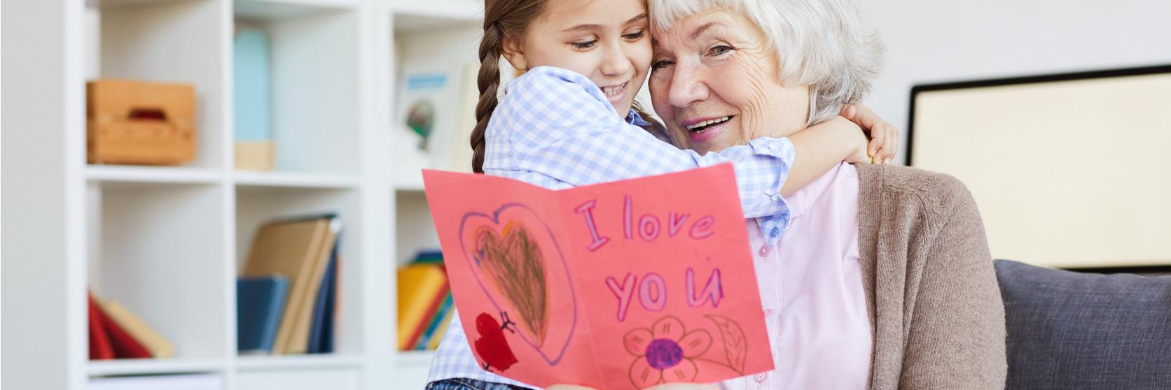 grandmother-granddaughter-reading-card