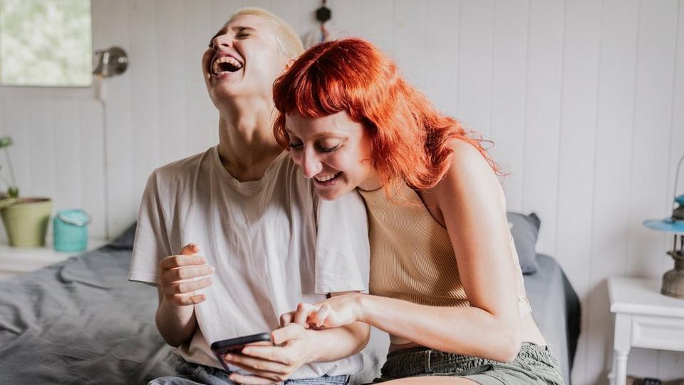 two-women-laughing-together