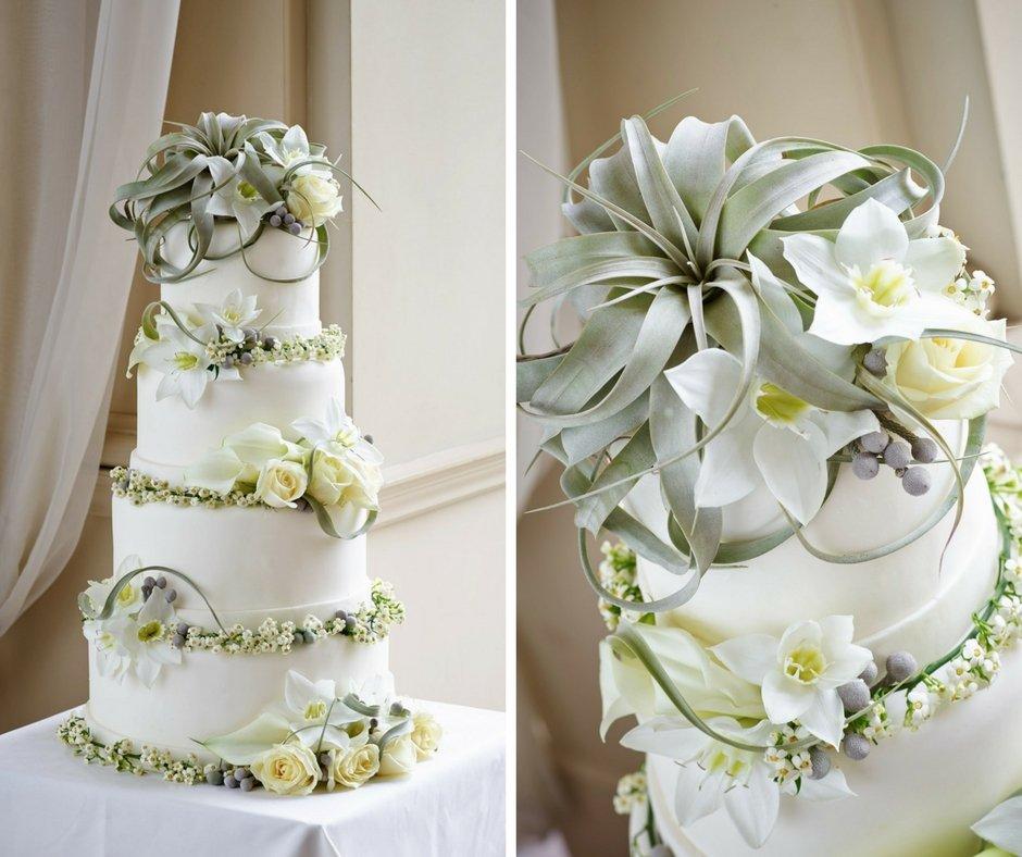 white-wedding-cake-with-white-floral-decorations