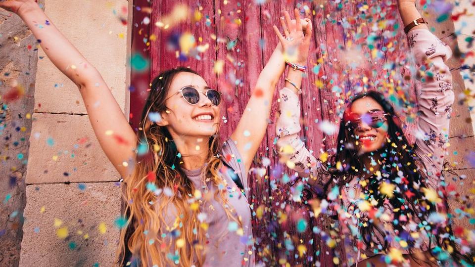 women-confetti-celebrating